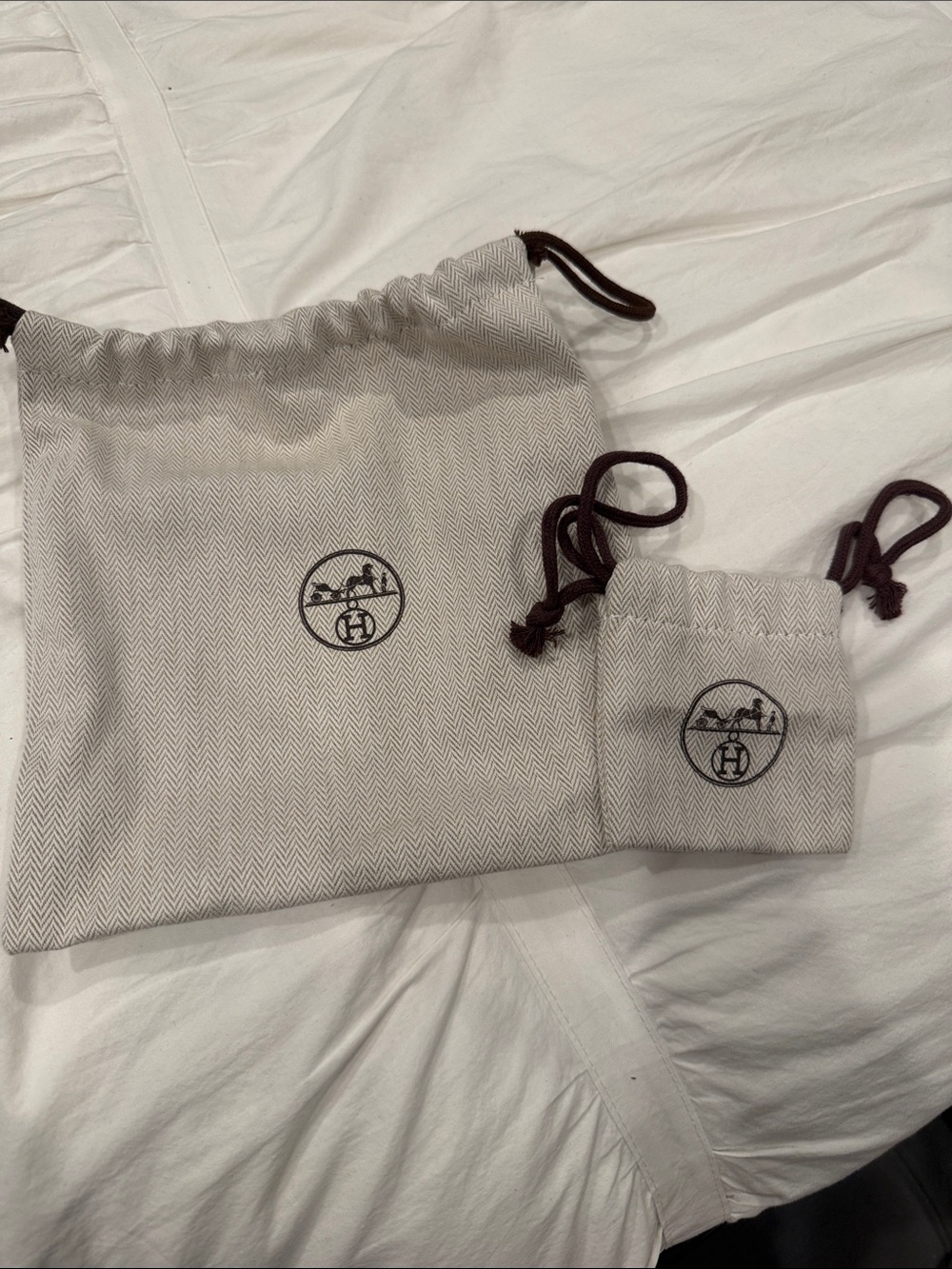 Hermes belt and buckle drawstring pouch set.